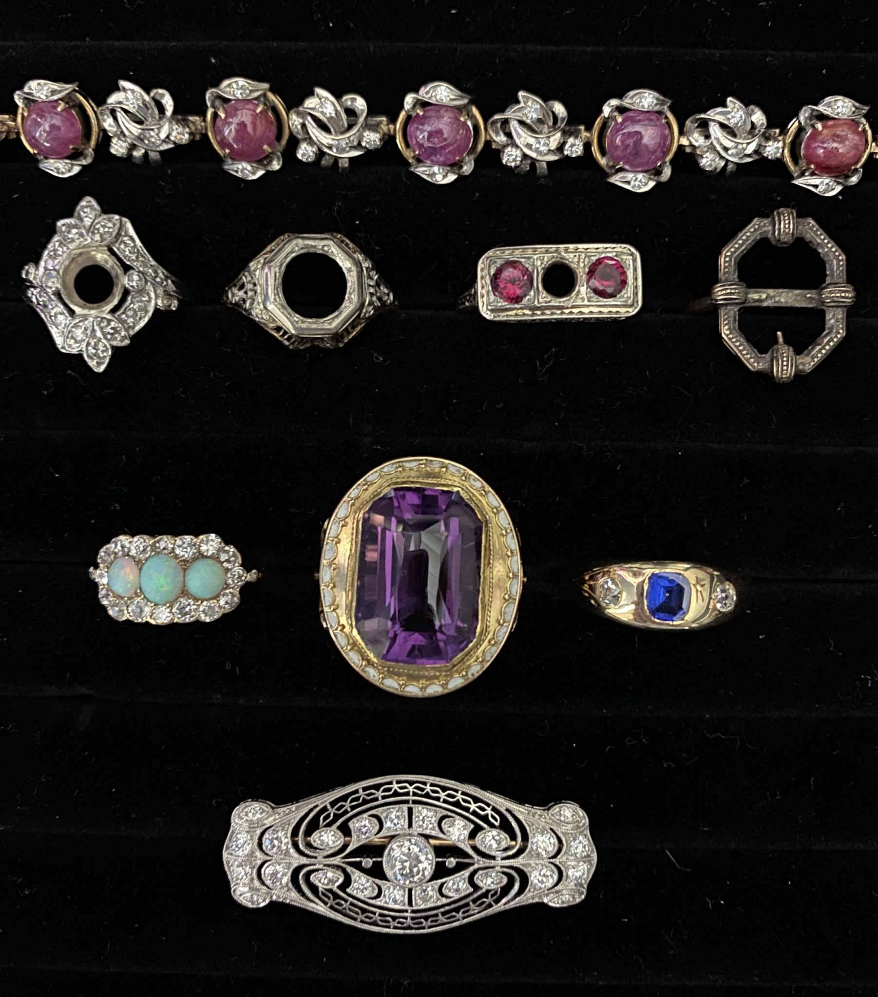 A grouping of antique and vintage jewelry