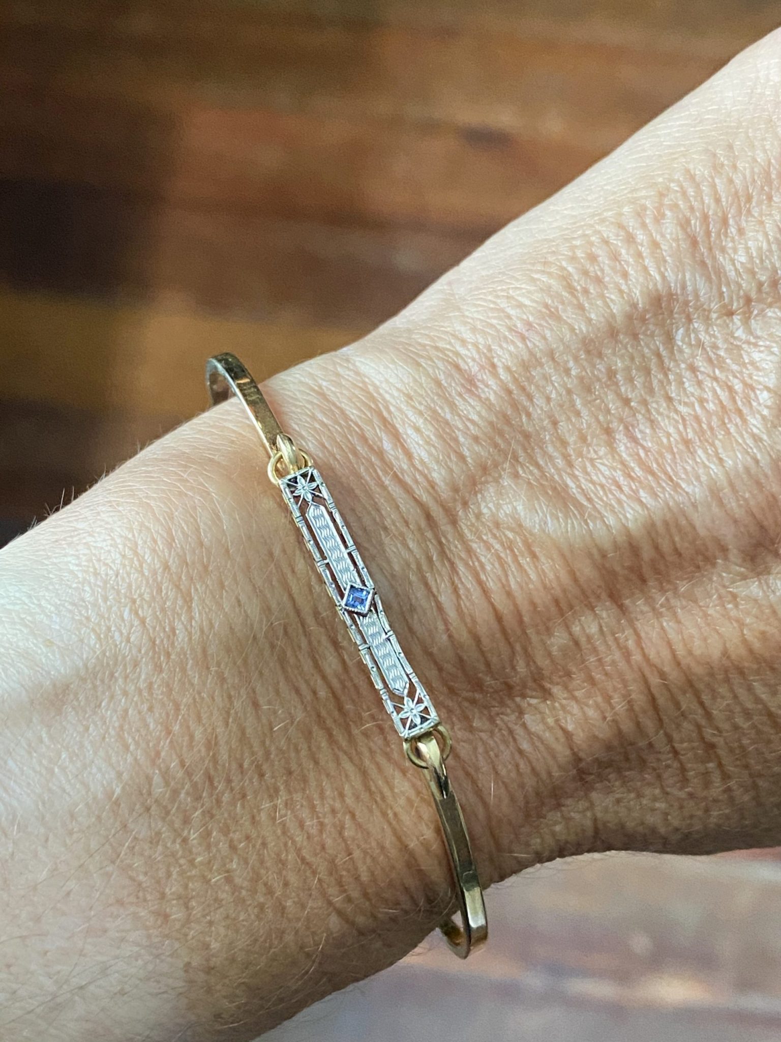 Two tone Antique Lingerie Pin Bracelet with a sapphire.